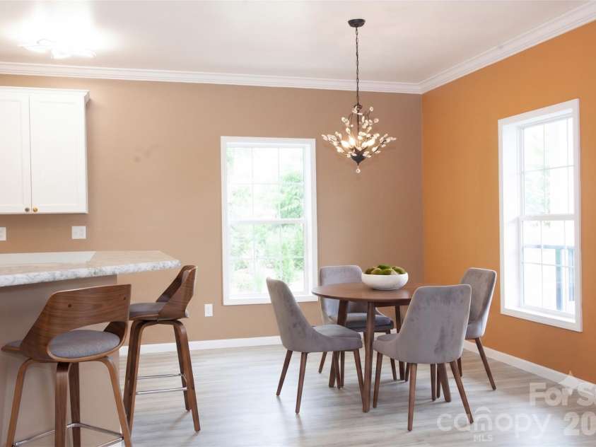 83 Moss Hill Drive, Hendersonville, NC 28792.  MLS# CAR4327286, YatesRealty ID 7589. Dining Area and Bar Virtually Staged