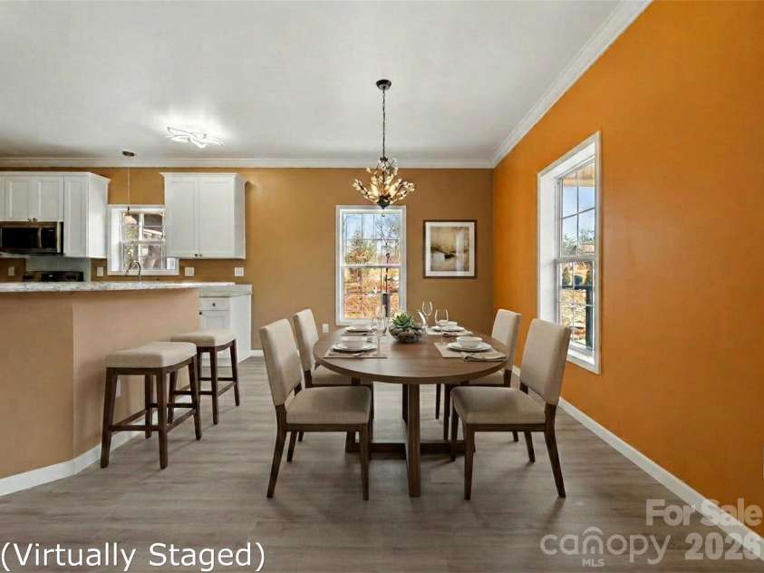 83 Moss Hill Drive, Hendersonville, NC 28792.  MLS# CAR4327286, YatesRealty ID 7589. Dining Area and bar virtually staged