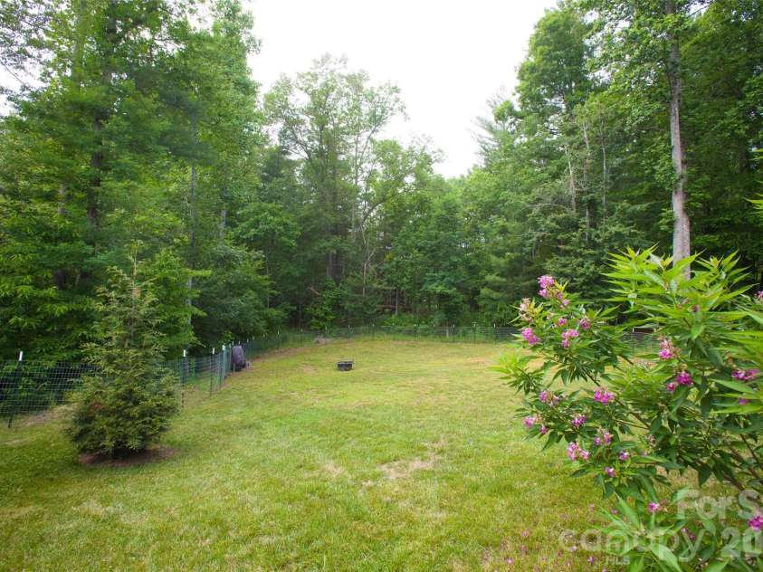 83 Moss Hill Drive, Hendersonville, NC 28792.  MLS# CAR4327286, YatesRealty ID 7589. Large fenced yard