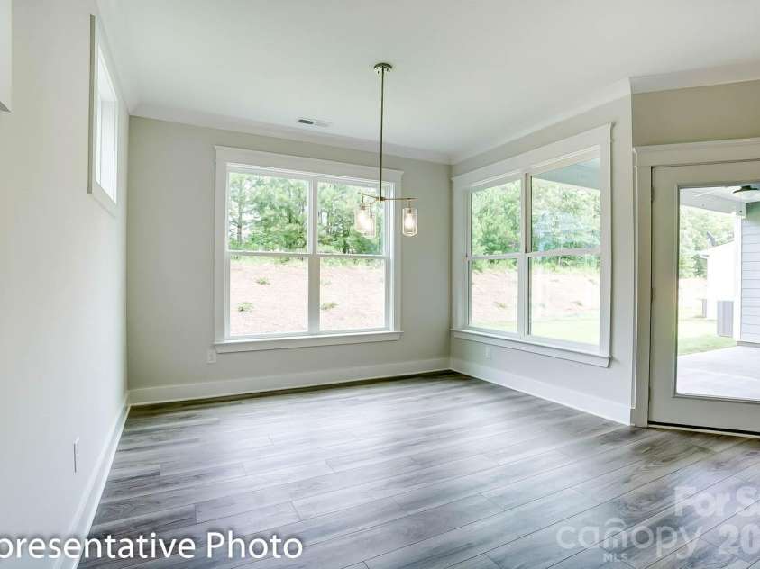 4010 Cedar Falls Drive, Waxhaw, NC 28173.  MLS# CAR4325530, YatesRealty ID 7599. Breakfast area with door to covered rear porch
