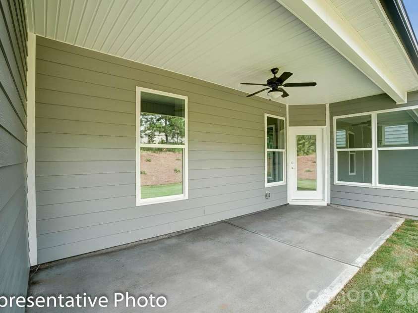 4010 Cedar Falls Drive, Waxhaw, NC 28173.  MLS# CAR4325530, YatesRealty ID 7599. Covered porch at rear of home