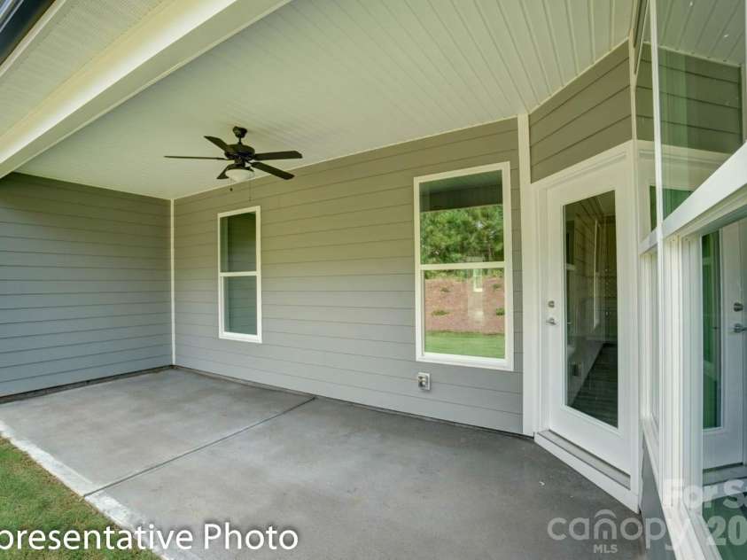 4010 Cedar Falls Drive, Waxhaw, NC 28173.  MLS# CAR4325530, YatesRealty ID 7599. Covered porch at rear of home