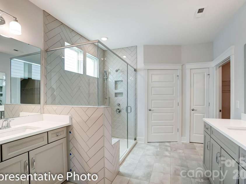 4010 Cedar Falls Drive, Waxhaw, NC 28173.  MLS# CAR4325530, YatesRealty ID 7599. Primary bath with optional luxury shower