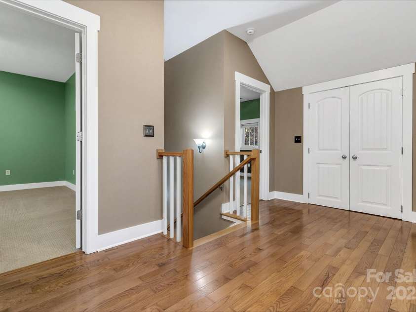 241 Fern Way, Black Mountain, NC 28711.  MLS# CAR4196971, YatesRealty ID 7601. Landing at the top of the stairs leading to the primary bedroom and guest suite.