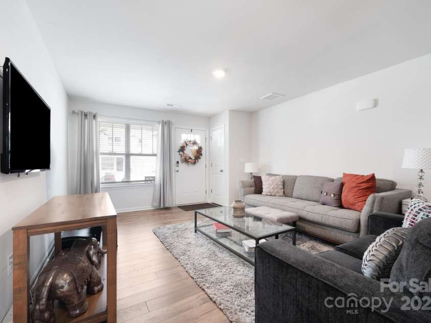 40 Malcolm Court, Candler, NC 28715.  MLS# CAR4281159, YatesRealty ID 761. Front Entry Opens to Living Room with luxury Rev-wood flooring on Main level