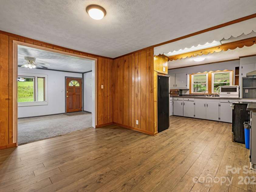 8171 Sugar Hill Road, Marion, NC 28752.  MLS# CAR4296295, YatesRealty ID 7625. Dining looking into kitchen and LR
