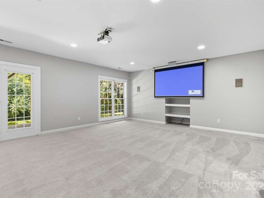 11139 Tradition View Drive, Charlotte, NC 28269.  MLS# CAR4306153, YatesRealty ID 7629. Basement comes with projector and screen. Prewired for surround sound.