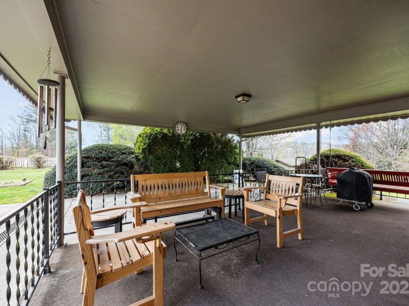 457 Overlook Drive, Spruce Pine, NC 287777.  MLS# CAR4245586, YatesRealty ID 7633. Carport entertaining space