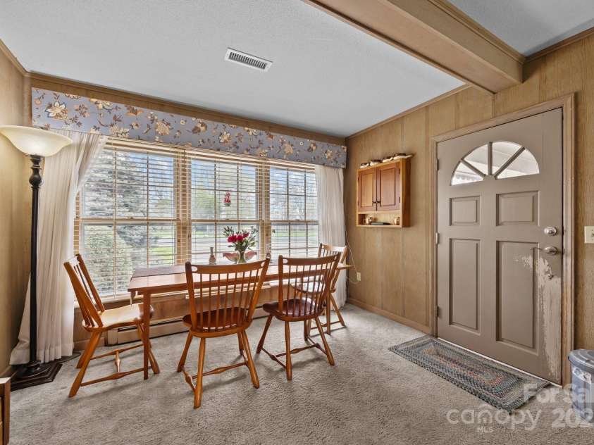 457 Overlook Drive, Spruce Pine, NC 287777.  MLS# CAR4245586, YatesRealty ID 7633. Dining nook overlooking front yard
