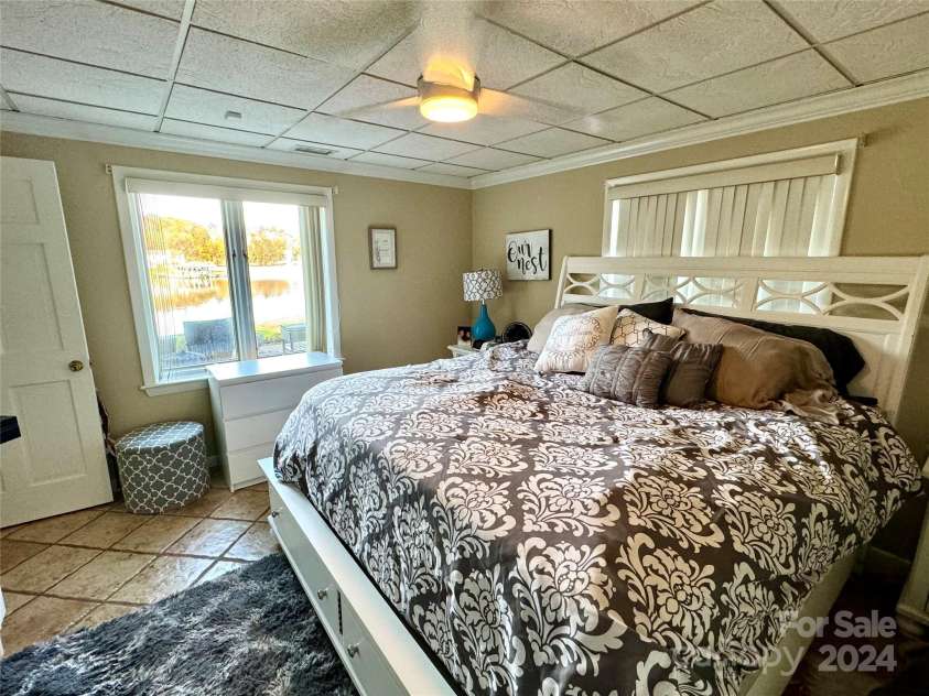 121 48th Avenue, Hickory, NC 28601.  MLS# CAR4203042, YatesRealty ID 7636. LOWER LEVEL BEDROOM WITH LAKE VIEWS