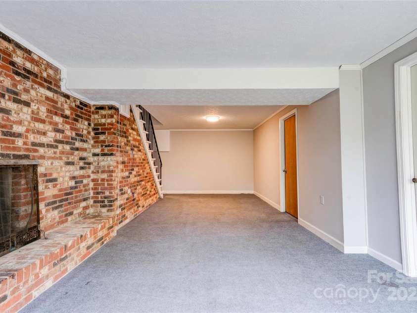 910 Surry Drive, Shelby, NC 28152.  MLS# CAR4249425, YatesRealty ID 7637. Family Room- Basement