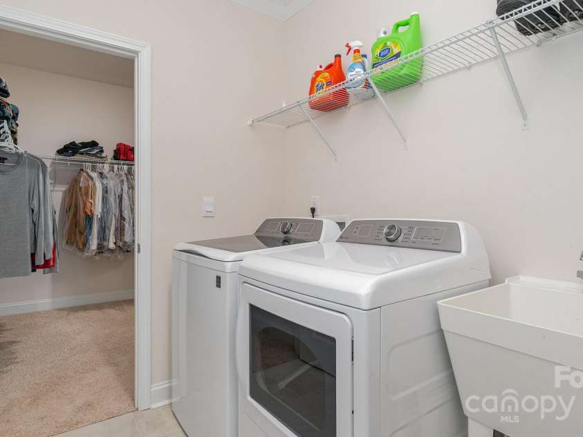 5043 Antebellum Drive, Iron Station, NC 28080.  MLS# CAR4245063, YatesRealty ID 7650. Laundry Room outside of primary cloest