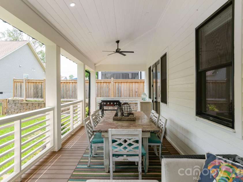 40 Hidden Pond Lane, Brevard, NC 28712.  MLS# CAR4355096, YatesRealty ID 7664. Back patio entertainment area
