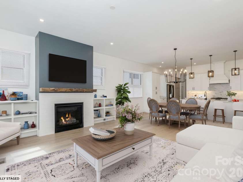 40 Hidden Pond Lane, Brevard, NC 28712.  MLS# CAR4355096, YatesRealty ID 7664. Natural Gas Fireplace Surrounded by built-ins