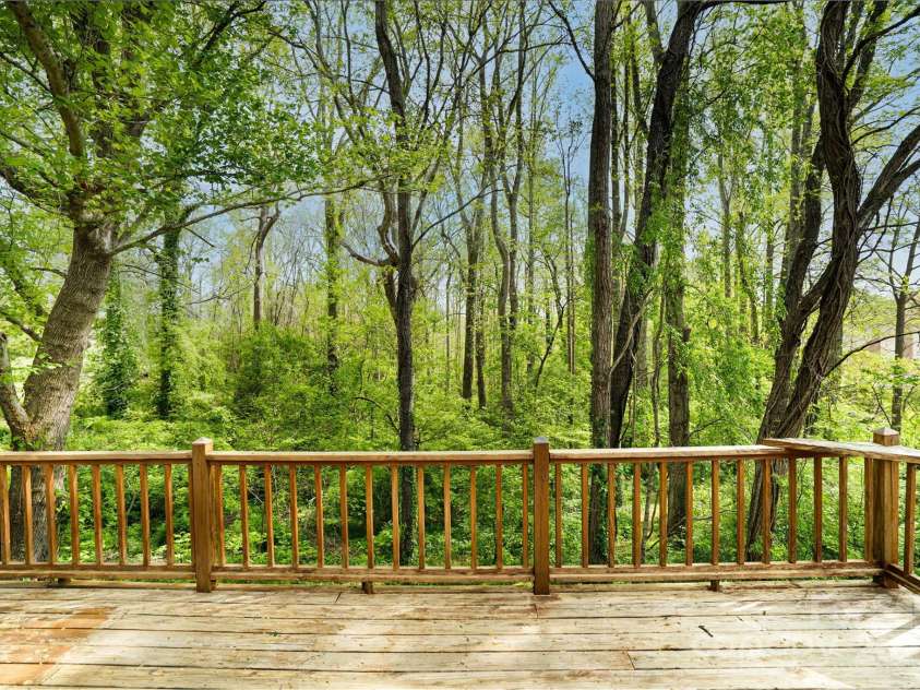 61 Bull Mountain Road, Asheville, NC 28805.  MLS# CAR4216001, YatesRealty ID 7664. Deck overlooking your own wooded back yard!