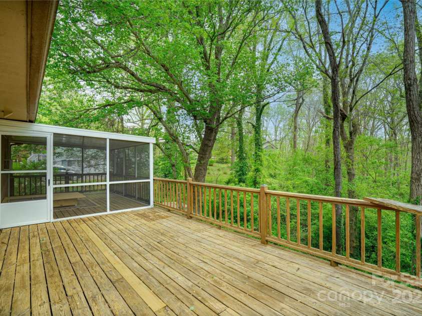 61 Bull Mountain Road, Asheville, NC 28805.  MLS# CAR4216001, YatesRealty ID 7664. Deck with screened-in sitting / sleeping space.