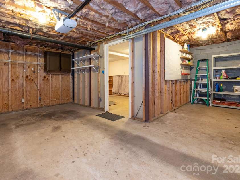 61 Bull Mountain Road, Asheville, NC 28805.  MLS# CAR4216001, YatesRealty ID 7664. Drive-in basement, work shop.