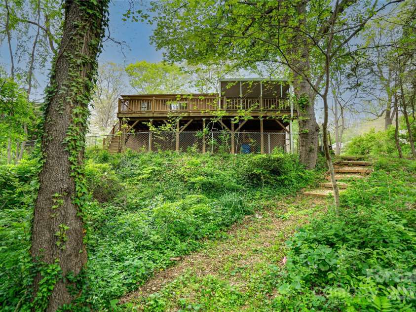 61 Bull Mountain Road, Asheville, NC 28805.  MLS# CAR4216001, YatesRealty ID 7664. View of the house from the sitting area path.