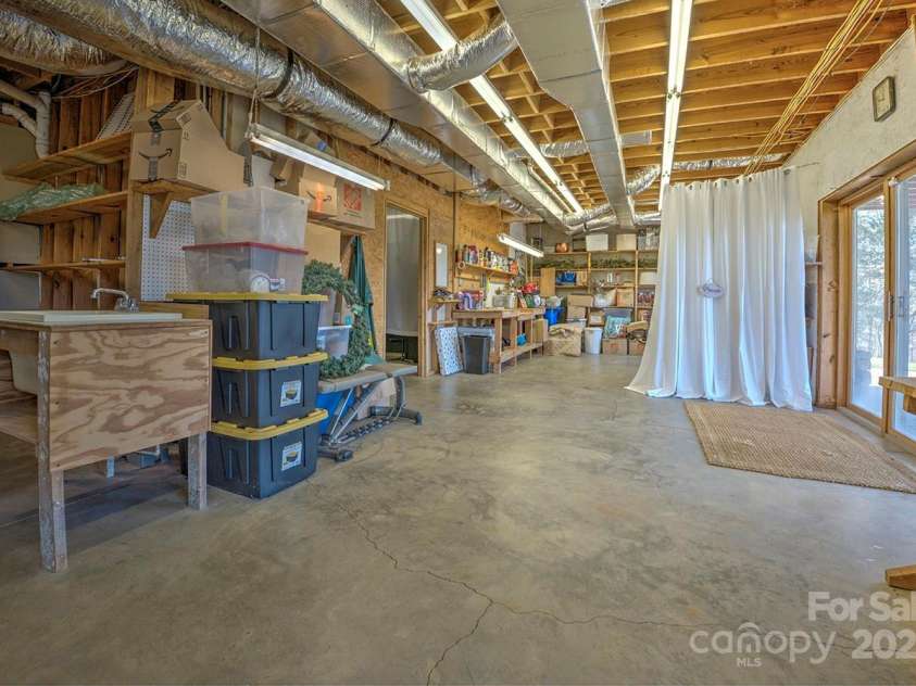723 Highland Road, Mill Spring, NC 28756.  MLS# CAR4244652, YatesRealty ID 7670. Basement storge