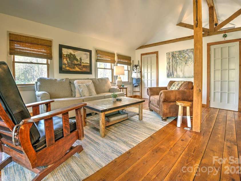 723 Highland Road, Mill Spring, NC 28756.  MLS# CAR4244652, YatesRealty ID 7670. Guest house living room