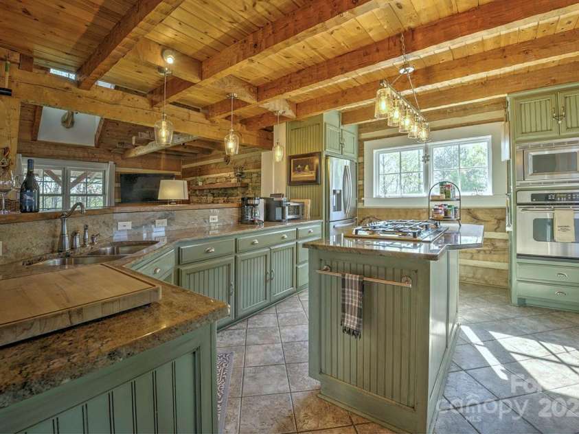 723 Highland Road, Mill Spring, NC 28756.  MLS# CAR4244652, YatesRealty ID 7670. Kitchen island