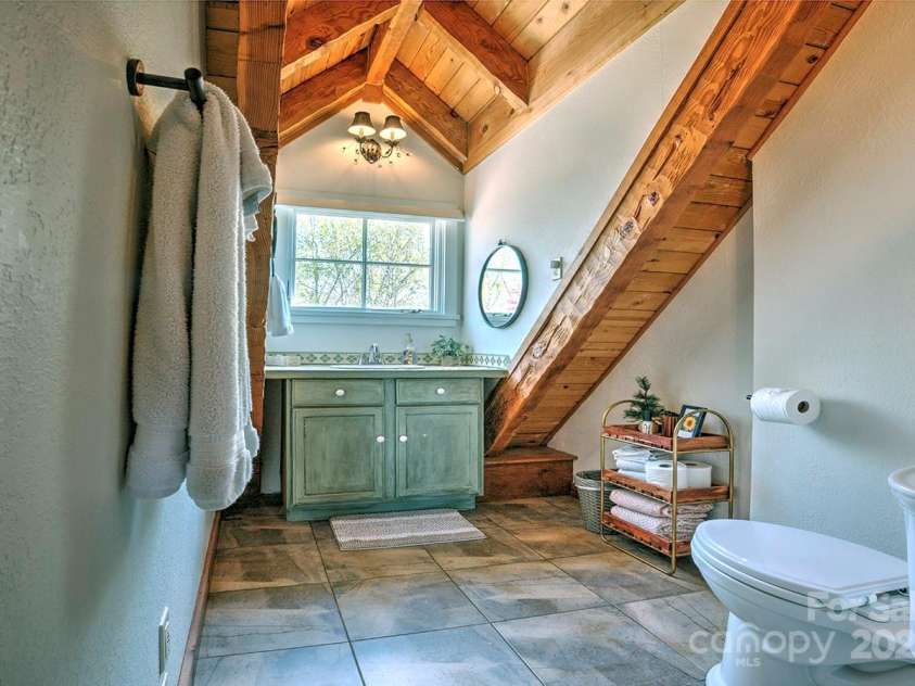 723 Highland Road, Mill Spring, NC 28756.  MLS# CAR4244652, YatesRealty ID 7670. Loft bath