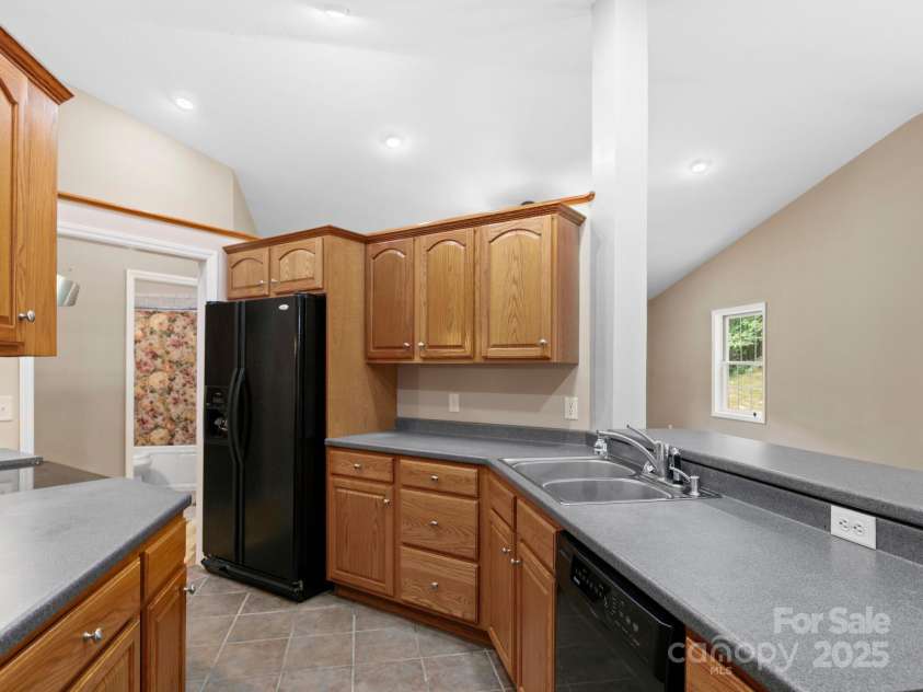 515 Pond Road, Asheville, NC 28806.  MLS# CAR4180837, YatesRealty ID 7674. Plenty of cabinet space for all your kitchen accessories! There is a pantry cabinet with pull out drawers for all the goodies!