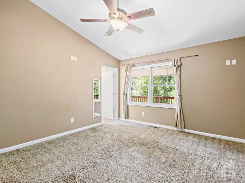 515 Pond Road, Asheville, NC 28806.  MLS# CAR4180837, YatesRealty ID 7674. The light filled primary room with ensuite bathroom for your private retreat!