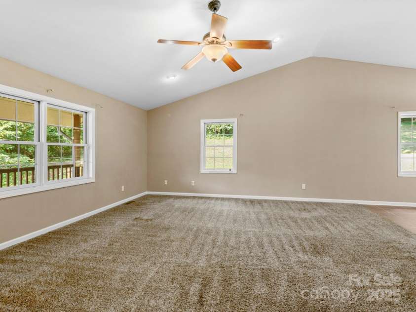 515 Pond Road, Asheville, NC 28806.  MLS# CAR4302486, YatesRealty ID 7674. Main level family room shown as is, with no furniture added