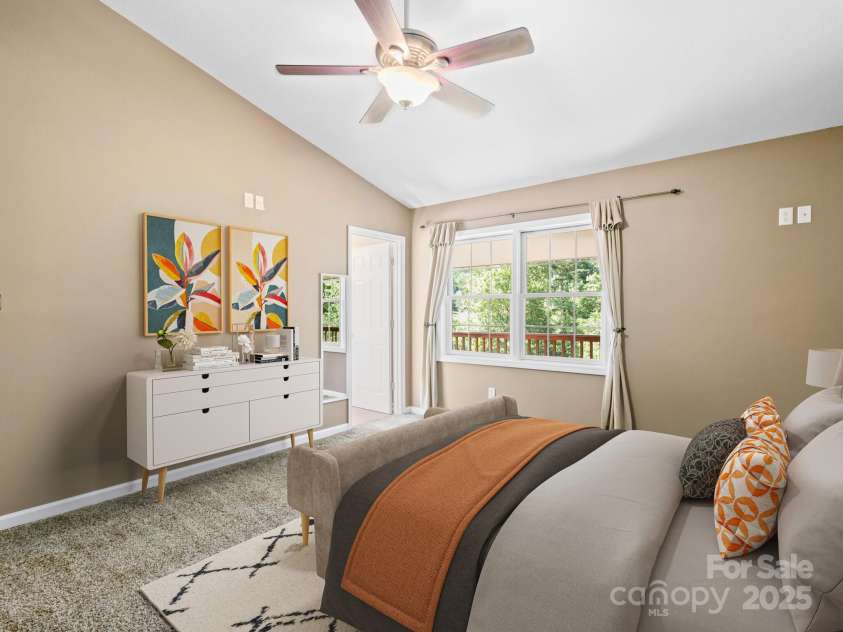 515 Pond Road, Asheville, NC 28806.  MLS# CAR4302486, YatesRealty ID 7674. Relax in your primary suite with en-suite bathroom. Virtually staged to show furniture ideas. 