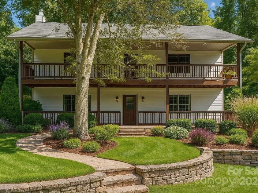 515 Pond Road, Asheville, NC 28806.  MLS# CAR4302486, YatesRealty ID 7674. The front yard is a blank slate ready for a design like this or one of your own. Virtually enhanced to add this landscape scene in. 