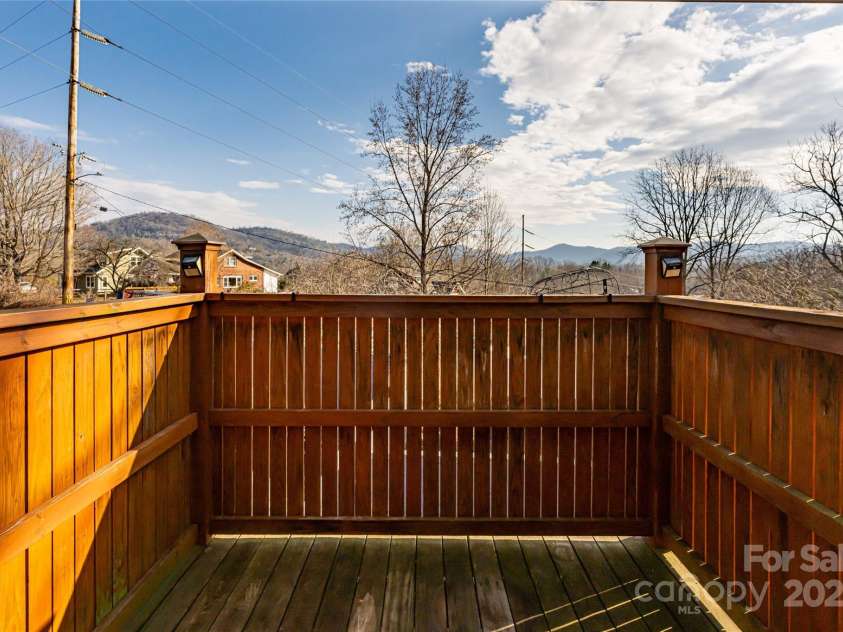 115 Elk Mountain Road, Asheville, NC 28804.  MLS# CAR4219629, YatesRealty ID 7675. Enclosed porch off of back entrance