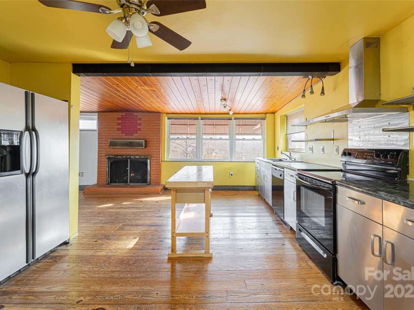 115 Elk Mountain Road, Asheville, NC 28804.  MLS# CAR4219629, YatesRealty ID 7675. Expansive kitchen area with stainless cabinetry