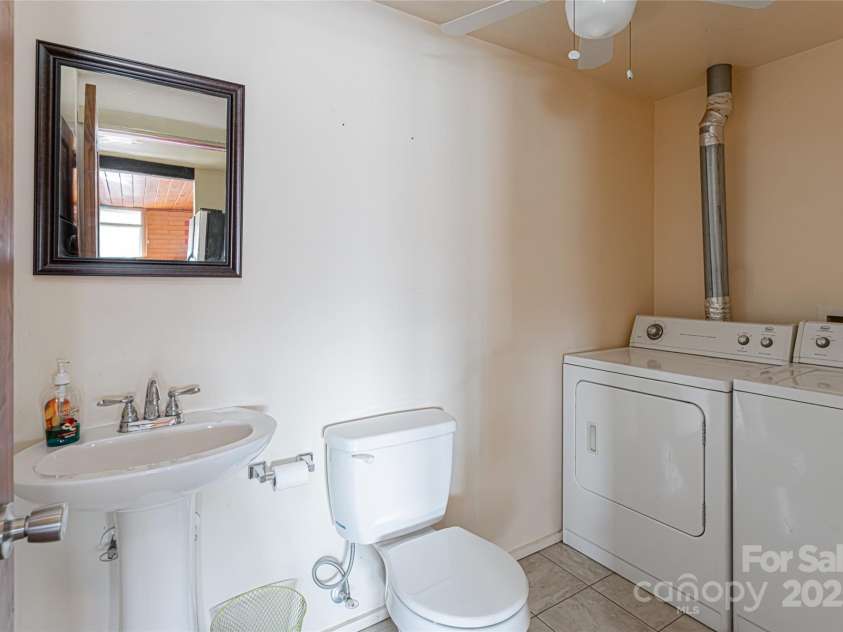 115 Elk Mountain Road, Asheville, NC 28804.  MLS# CAR4219629, YatesRealty ID 7675. Laundry half bath