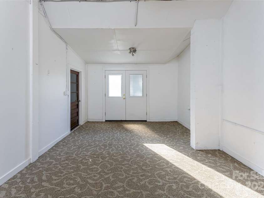 115 Elk Mountain Road, Asheville, NC 28804.  MLS# CAR4219629, YatesRealty ID 7675. Unit B with outdoor entrance, entrance to flex space and to storage area