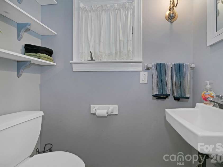 168 River Ridge Road, Brevard, NC 28712.  MLS# CAR4353588, YatesRealty ID 7686. 1/2 bath in laundry room