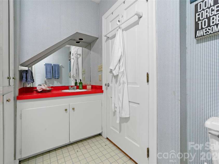 168 River Ridge Road, Brevard, NC 28712.  MLS# CAR4353588, YatesRealty ID 7686. Downstairs bath