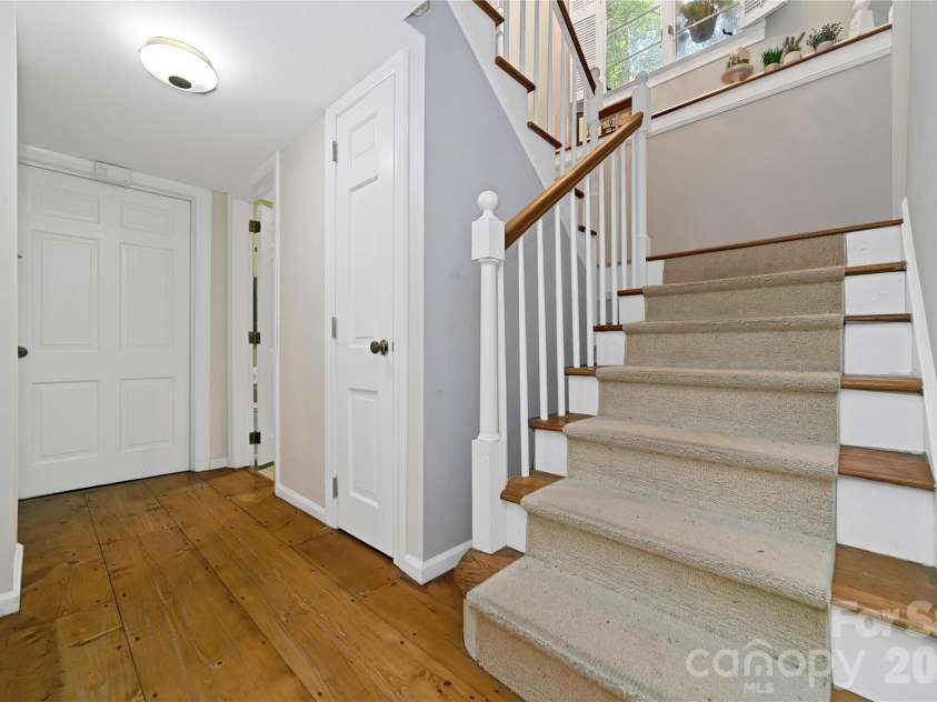 168 River Ridge Road, Brevard, NC 28712.  MLS# CAR4353588, YatesRealty ID 7686. Staircase to lower level