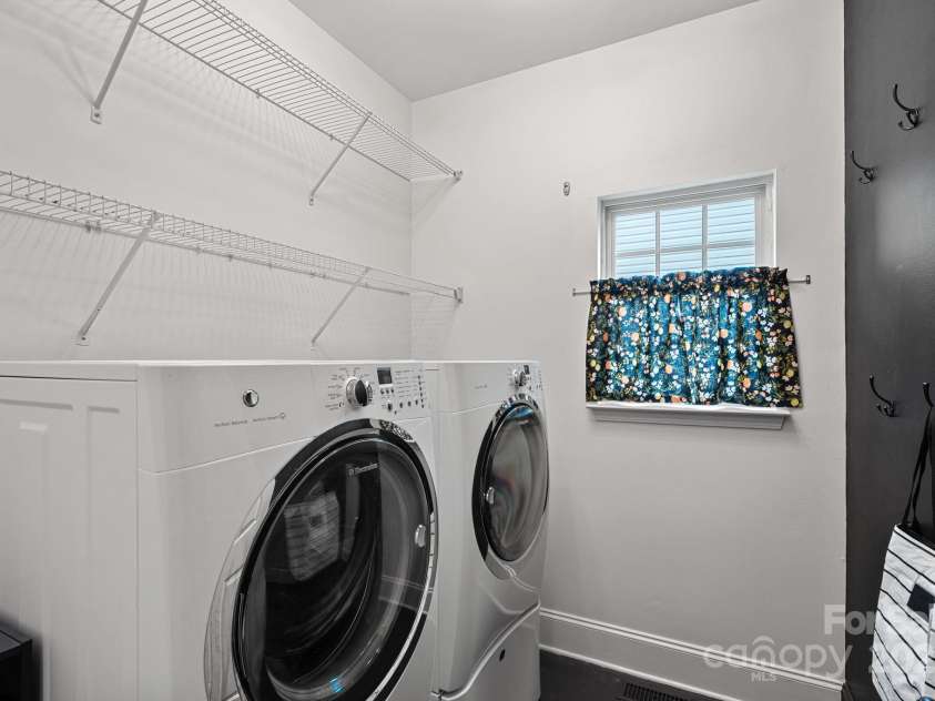 8600 Glade Court, Huntersville, NC 28078.  MLS# CAR4246992, YatesRealty ID 7694. Large laundry room with storage racks and hooks!