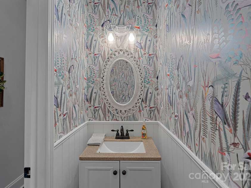 8600 Glade Court, Huntersville, NC 28078.  MLS# CAR4246992, YatesRealty ID 7694. Powder bath on main level is tucked away, has lovely trim and wallpaper!