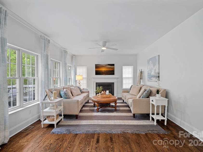 8600 Glade Court, Huntersville, NC 28078.  MLS# CAR4246992, YatesRealty ID 7694. The inviting living room features beautiful windos that flood the space with natural light creating a warm and welcoming space!