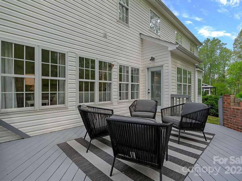 8600 Glade Court, Huntersville, NC 28078.  MLS# CAR4246992, YatesRealty ID 7694. The rear deck has a brick fireplace and overlooks the mostly private backyard!