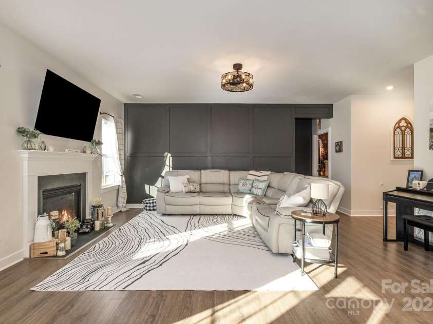 1844 Giana Lane, Monroe, NC 28112.  MLS# CAR4209401, YatesRealty ID 770. Bright and airry living room with custom accent wall