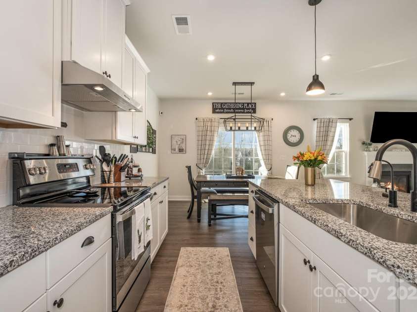 1844 Giana Lane, Monroe, NC 28112.  MLS# CAR4209401, YatesRealty ID 770. Open Kitchen with new lighting and hardware