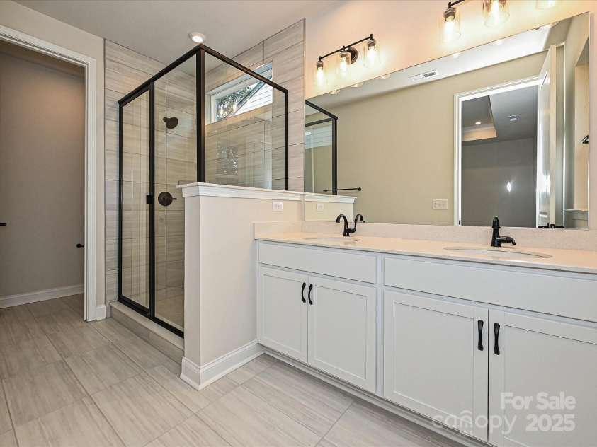 8034 Cedarsmith Court, Charlotte, NC 28217.  MLS# CAR4308403, YatesRealty ID 7701. Designer Primary Bath with Dual Vanity and Walk-In Shower.