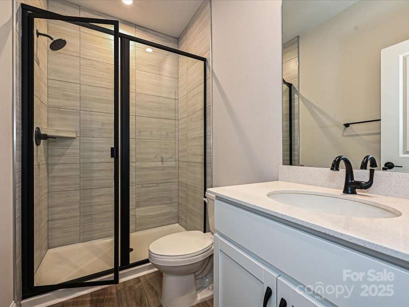 8034 Cedarsmith Court, Charlotte, NC 28217.  MLS# CAR4308403, YatesRealty ID 7701. First Floor Full Bath with Walk-In Shower.