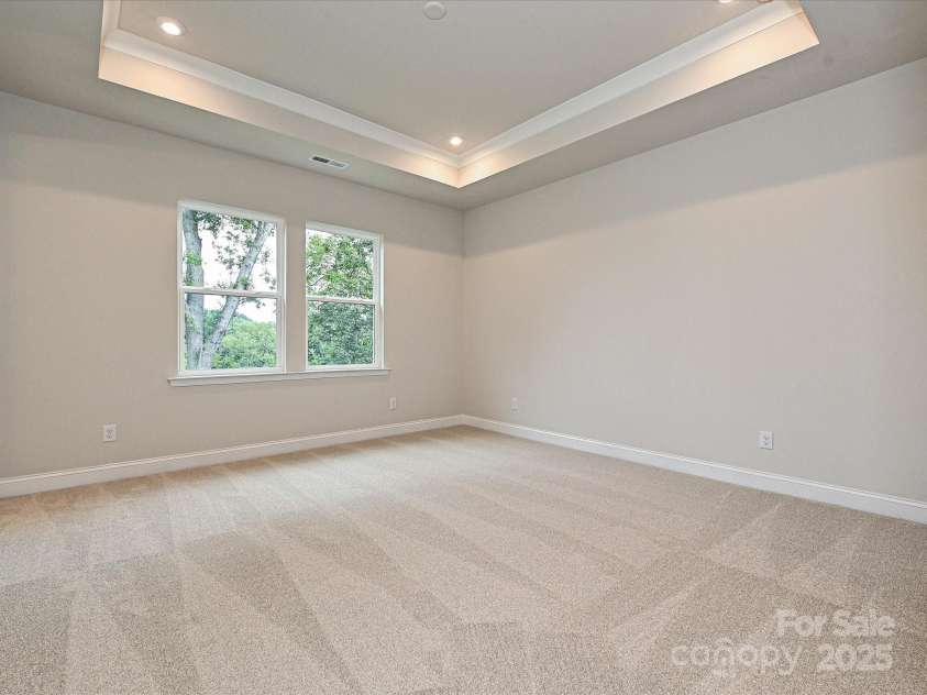 8034 Cedarsmith Court, Charlotte, NC 28217.  MLS# CAR4308403, YatesRealty ID 7701. Primary Suite with Grand Tray Ceiling and Unobstructed Views.