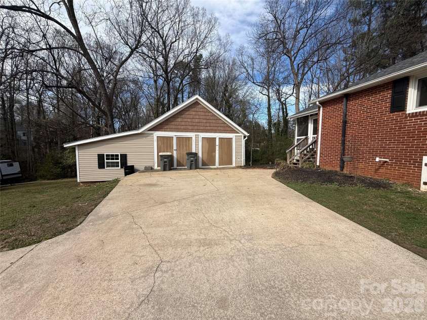 112 Elwood Street, Kannapolis, NC 28081.  MLS# CAR4353308, YatesRealty ID 7705. Extensive driveway with detached workshop with extra side storage 