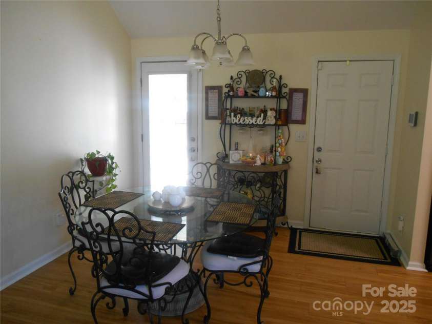 158 Margaret Turner Road, Charlotte, NC 28216.  MLS# CAR4243785, YatesRealty ID 7710. Dining area with door to the two car garage and a door leading to the extended patio.