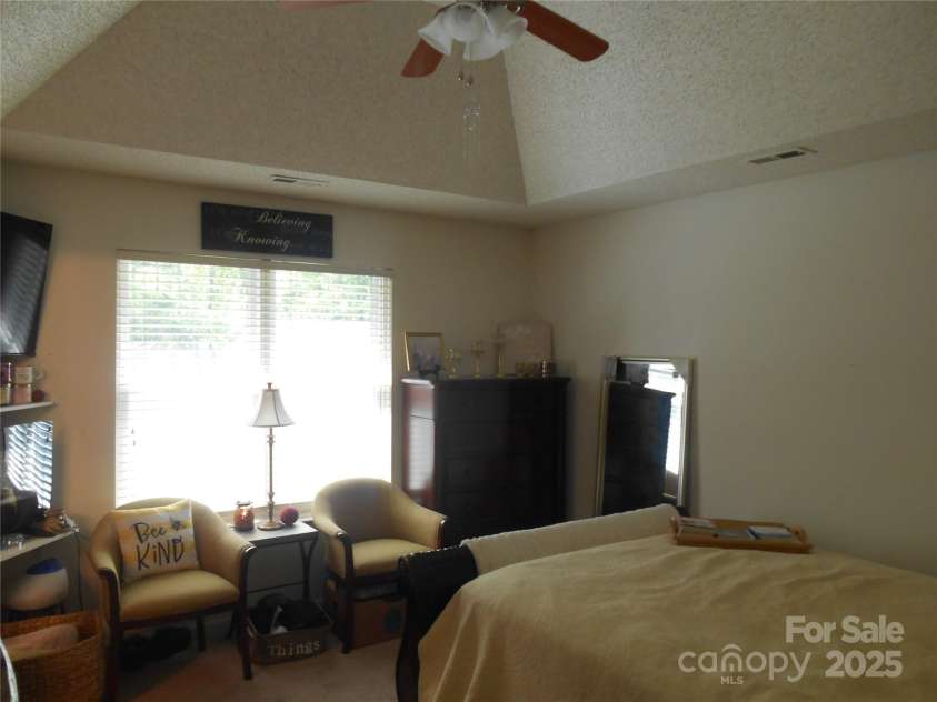 158 Margaret Turner Road, Charlotte, NC 28216.  MLS# CAR4243785, YatesRealty ID 7710. Primary bedroom with trey ceiling and ceiling fans.